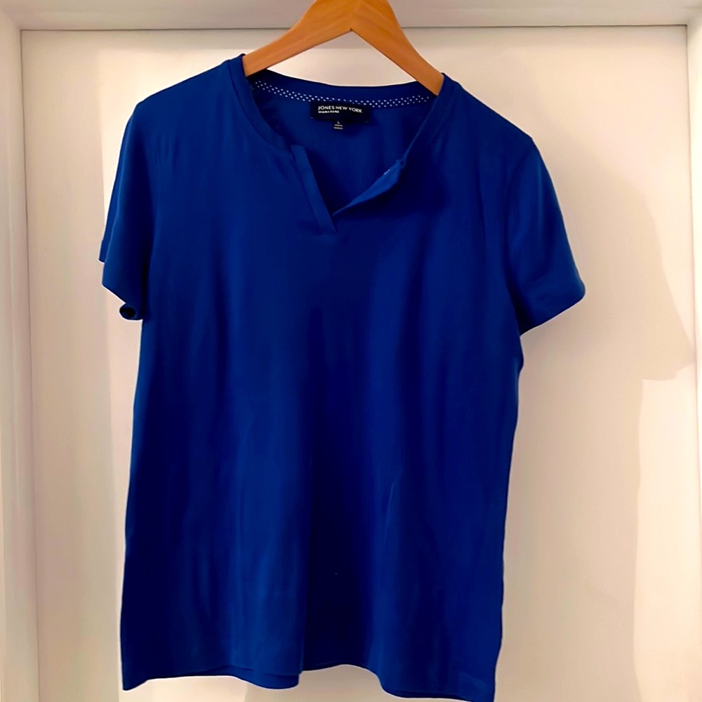 Polo top royal blue perfect condition with small like pleats in the front